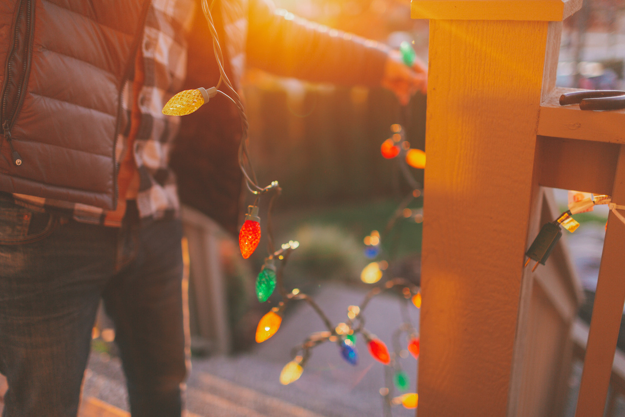 Man Hanging Christmas Lights