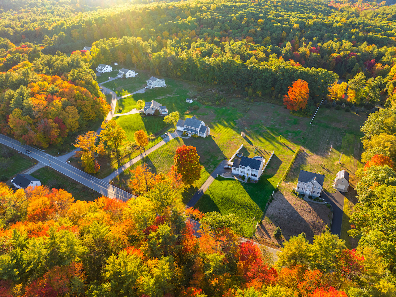 Aerial View Of Residential Community In Autumn Sunlight